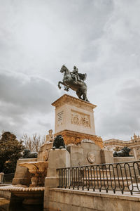 Low angle view of statue against sky