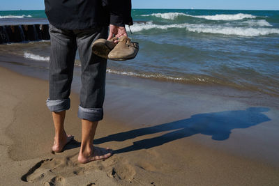 Woman standing on beach