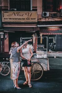 Woman standing at railroad station