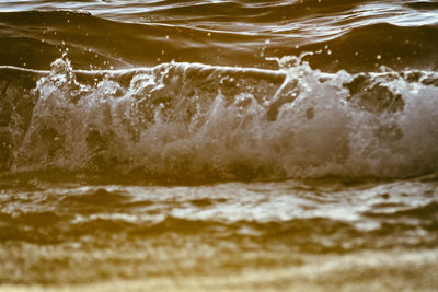 Close-up of waves splashing in sea