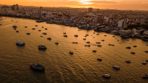 High angle view of city buildings during sunset