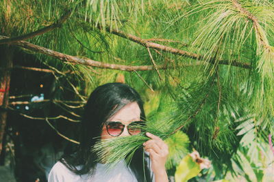 Close-up of young woman in park