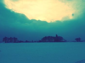 Scenic view of landscape against cloudy sky