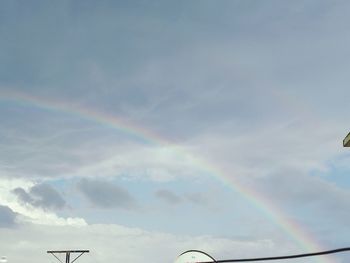 Low angle view of rainbow against sky