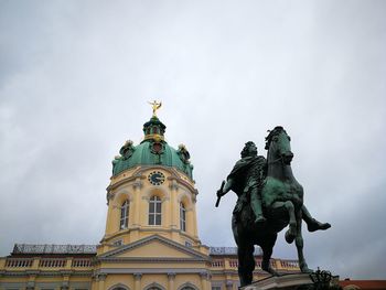 Low angle view of statue against sky