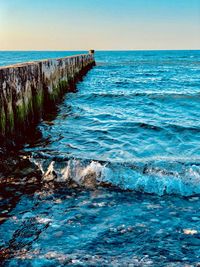 Scenic view of sea against clear blue sky