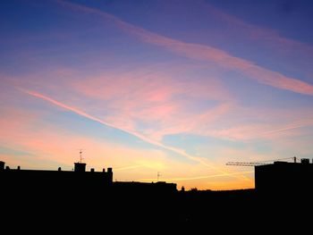 Silhouette of building at sunset