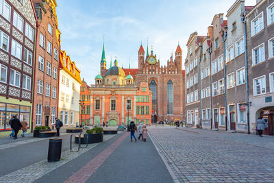 People walking on street in city