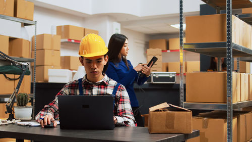 Side view of man working at construction site