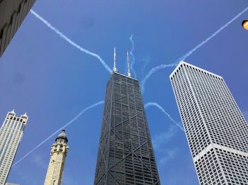 Low angle view of smoke stack against sky