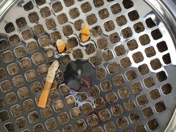 High angle view of cigarette in container