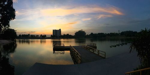 Scenic view of lake against sky at sunset