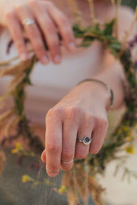 Cropped hand of woman holding hands