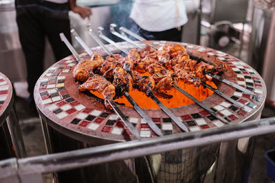 Close-up of tandoori chicken on barbecue grill