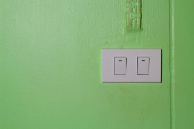 Close-up of green light on wall