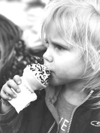 Close-up of girl eating ice cream cone