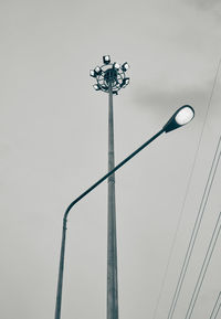 Low angle view of street light against sky