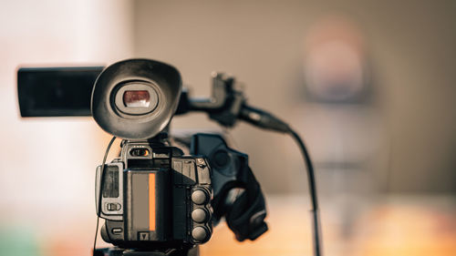 Close-up image of a camera at an outdoor press conference