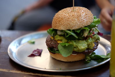 Close-up of burger in plate on table