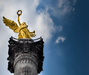 Low angle view of statue against sky