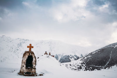 Scenic view of snowcapped mountains against sky