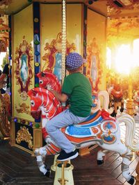 Rear view of people at amusement park