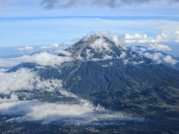 Aerial view of mountain range against sky