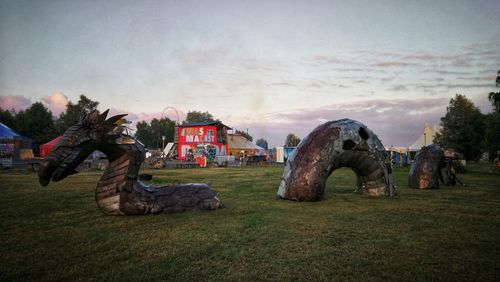 View of horses on field against sky