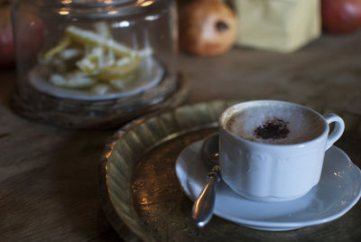 Close-up of coffee cup on table