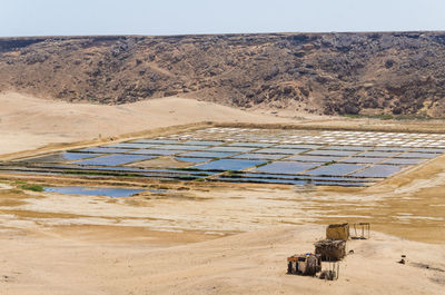 Scenic view salt mining against sky in mucuio, namib desert, angola