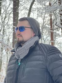 Portrait of young man in forest