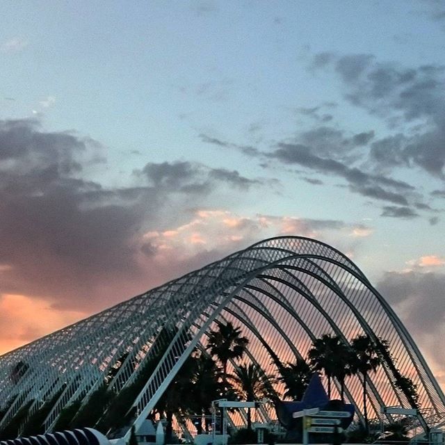 architecture, built structure, sky, building exterior, low angle view, cloud - sky, modern, city, cloudy, cloud, office building, sunset, skyscraper, glass - material, tall - high, building, tower, outdoors, dusk, no people