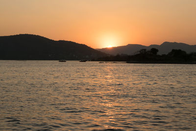 Scenic view of sea against sky during sunset