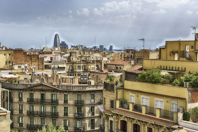 Buildings in city against sky