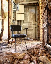 Empty chair in abandoned building