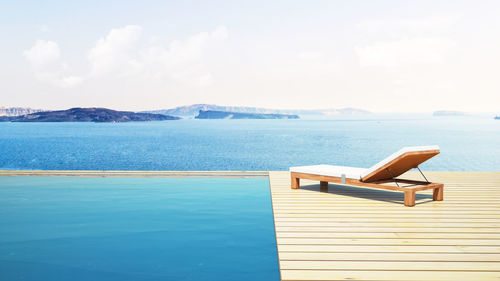 Close-up of swimming pool by sea against sky