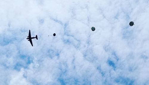 Low angle view of airplane flying in sky