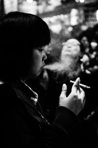 Close-up of woman smoking cigarette