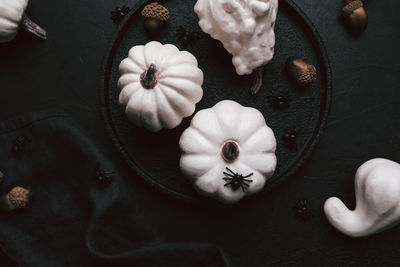 High angle view of white roses on table