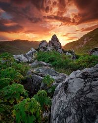 Scenic view of rocky mountains against sky during sunset