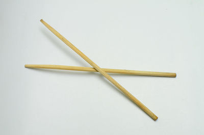 High angle view of colored pencils on white background