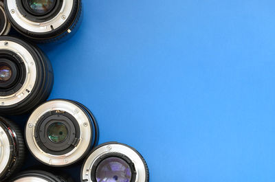 High angle view of lens on blue background