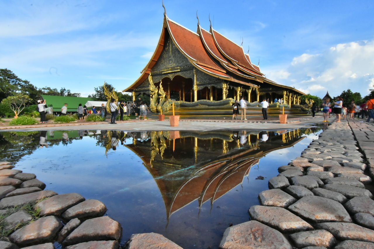 architecture, religion, spirituality, place of worship, built structure, reflection, sky, building exterior, water, outdoors, day, real people, ancient, men, nature, one person, people