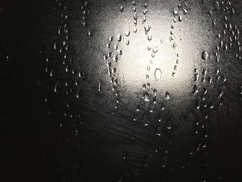 Close-up of water drops on glass