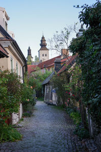 View of canal amidst buildings against clear sky