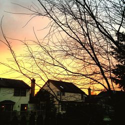 Buildings against sky at sunset