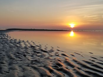 Scenic view of sea against sky at sunset