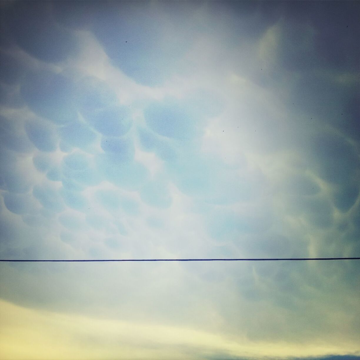 low angle view, sky, cloud - sky, cloudy, cloud, tranquility, beauty in nature, nature, scenics, tranquil scene, no people, outdoors, power line, cloudscape, backgrounds, sky only, overcast, weather, day, idyllic