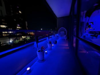 Balcony with blue hue lights and skyline view