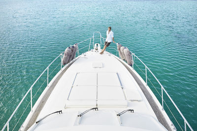 Mature man on deck of his motor yacht